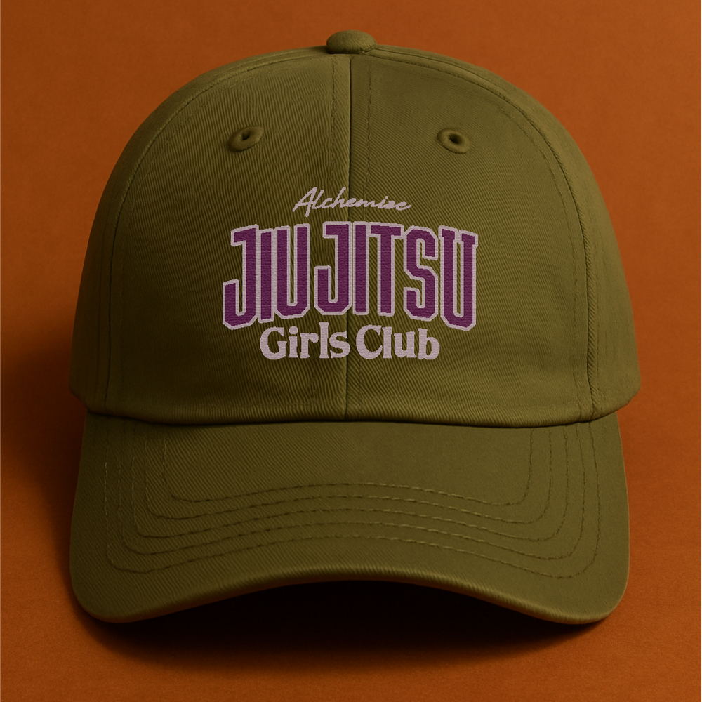 Green cap with 'Jiu Jitsu Girls Club' text on an orange background