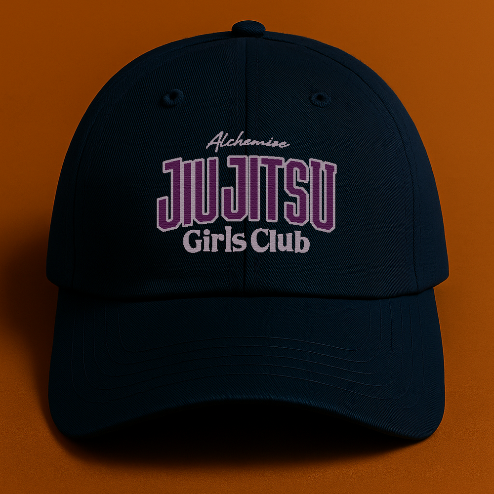 Navy cap with 'Jiu Jitsu Girls Club' text on an orange background
