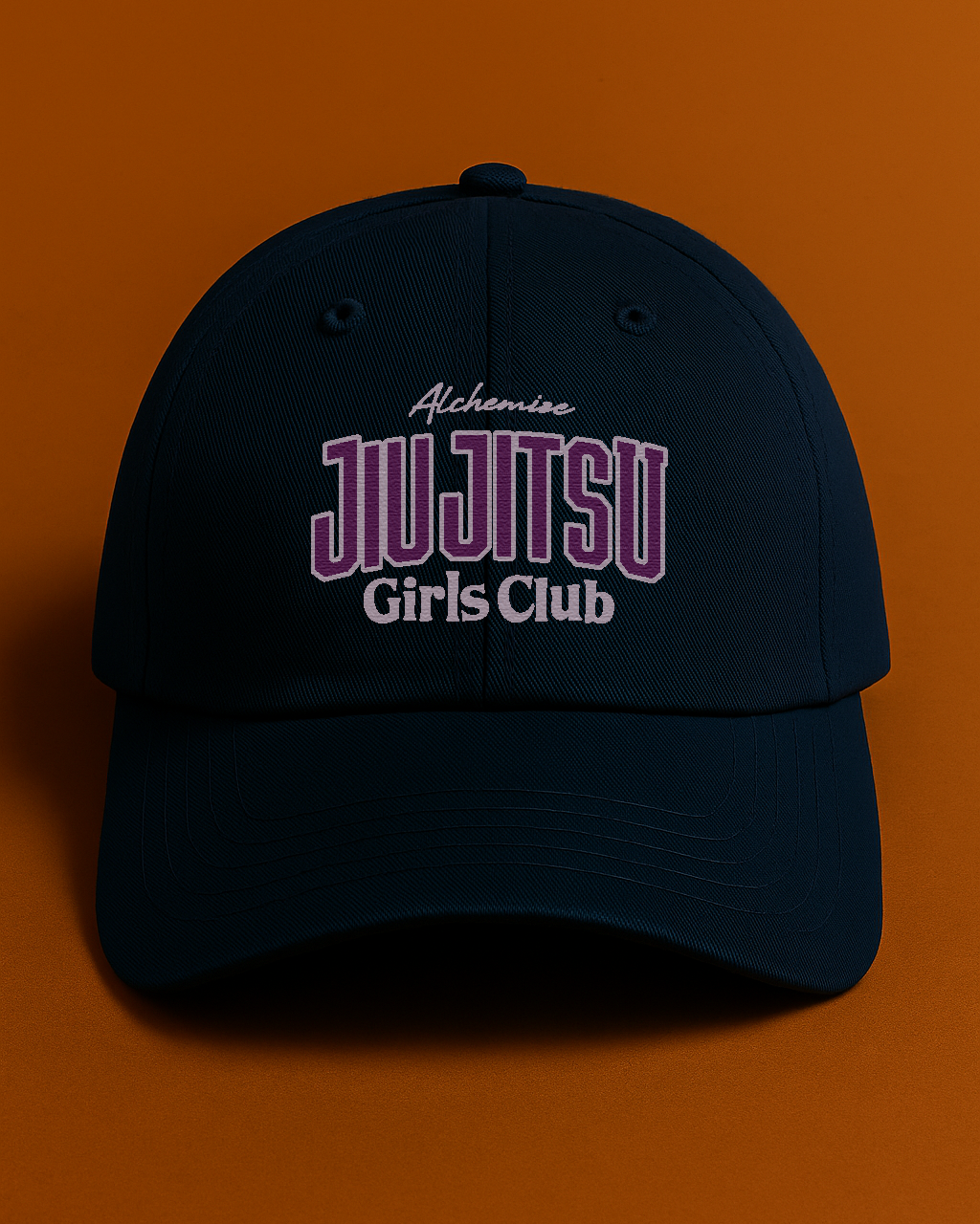 Navy cap with 'Jiu Jitsu Girls Club' text on an orange background