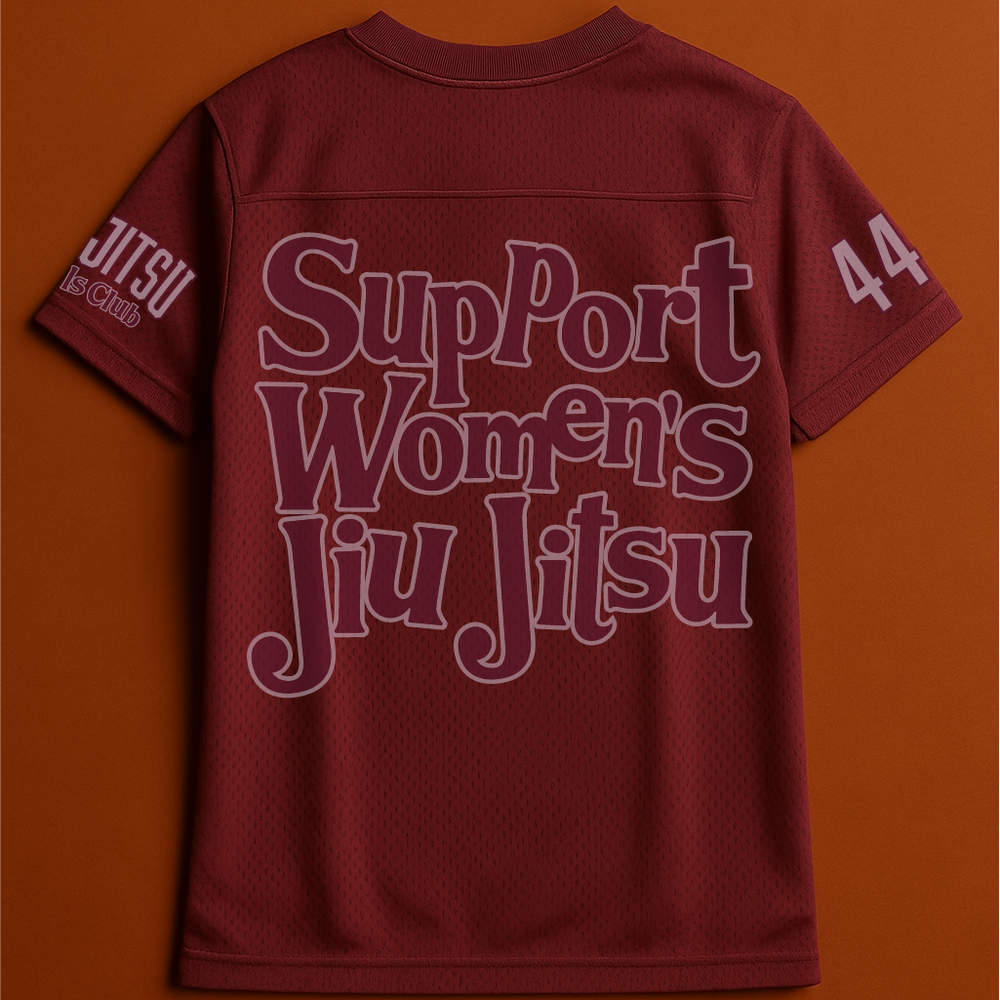 Maroon shirt with 'Support Women's Jiu Jitsu' text on an orange background