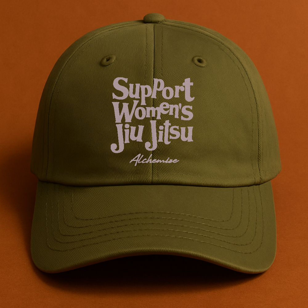 Green cap with 'Support Women's Jiu Jitsu' text on an orange background