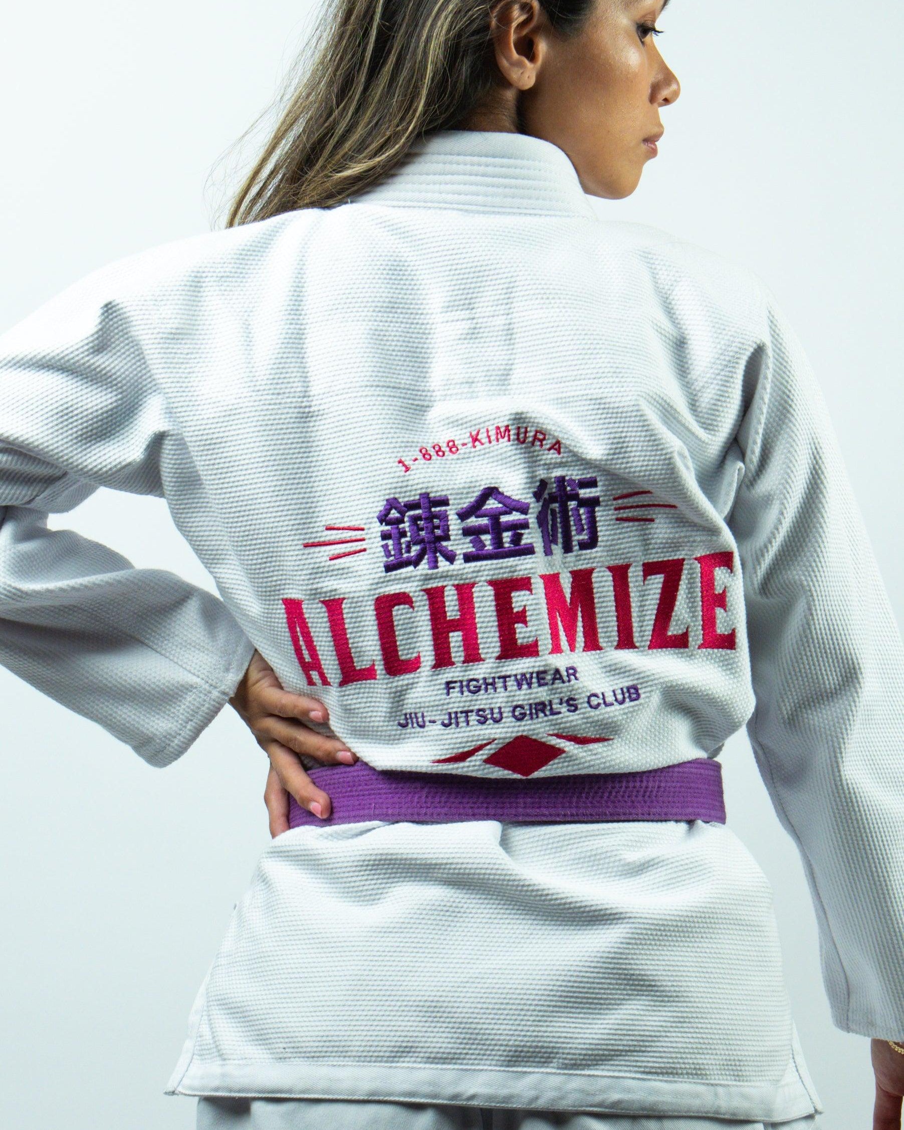 Female athlete wearing Alchemize Fightwear white rash guard